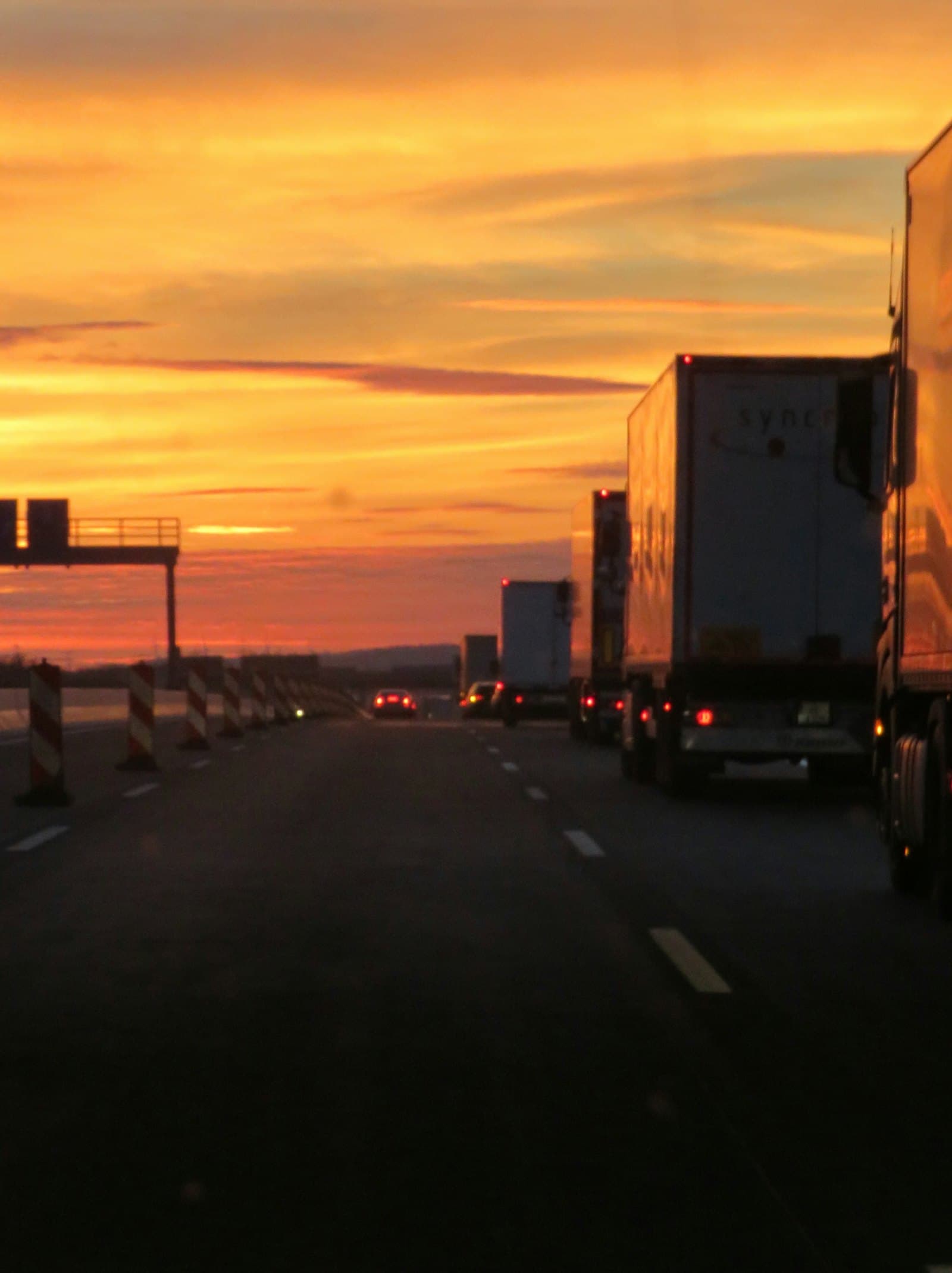 NAVI Cargo semi truck on the highway at sunset